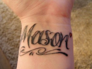 left wrist tattoo 'Mason'
