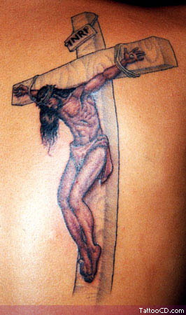 Crucifix cross tattoo on back