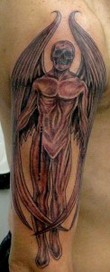 man with skull angel tattoo on his arm