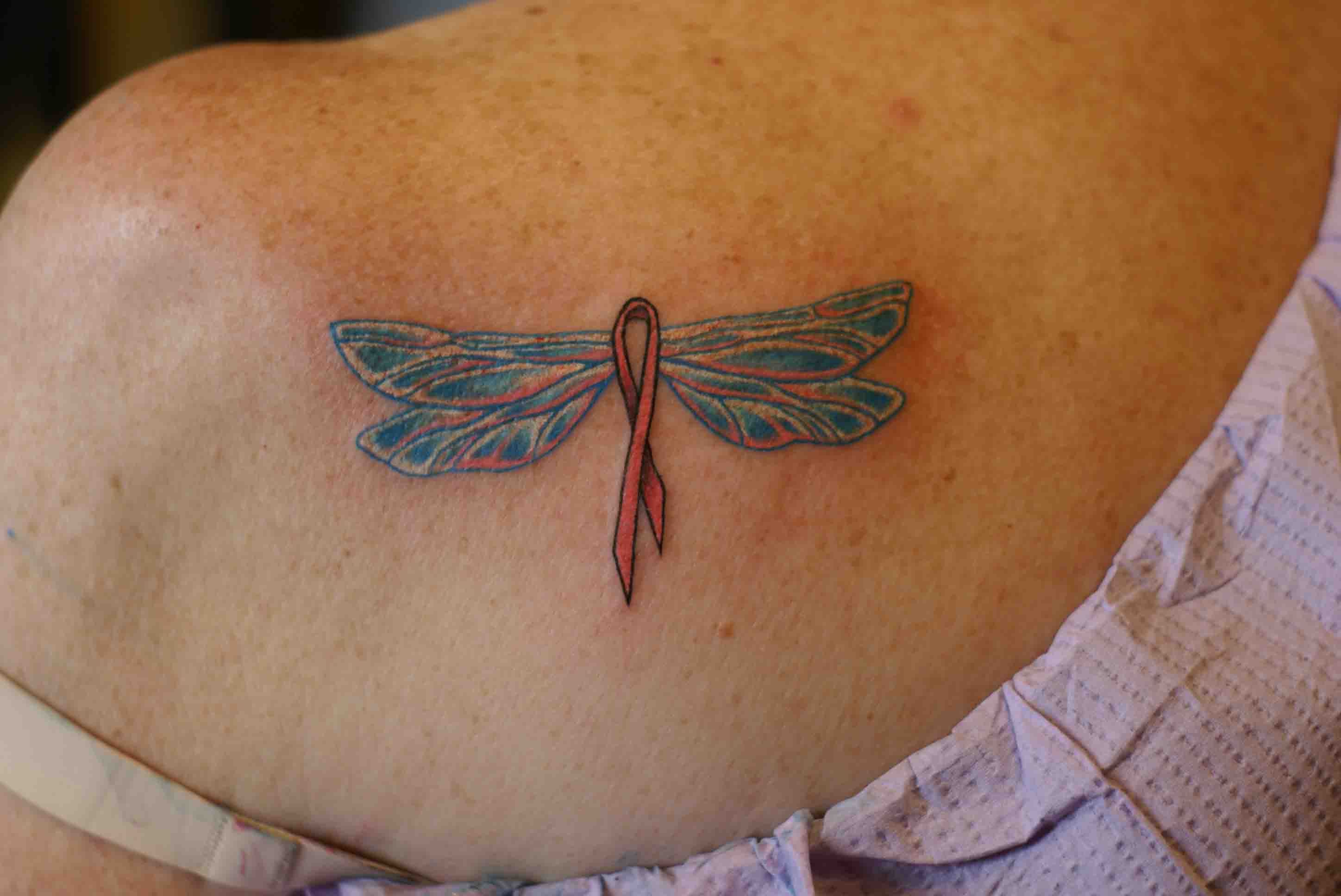 Dragon Fly tattoo for breast cancer awareness on a woman's back
