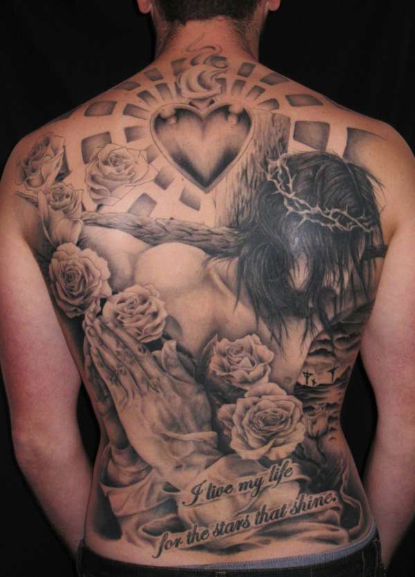 full art back tattoo with jesus and a heart