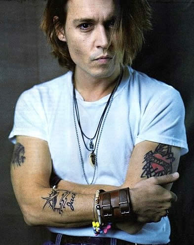 Johnny Depp on Johnny Depp And His Bird Tattoo On The Forearm