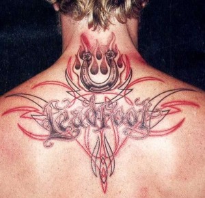 Interesting Tattoo on guy's neck and back Interesting Tattoo