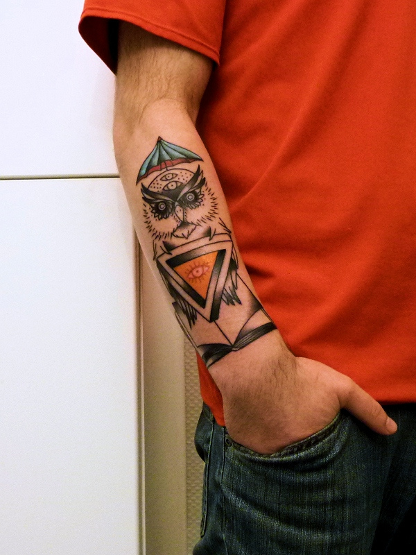 owl tattoo on forearm