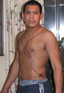 rosary tattoo on chest