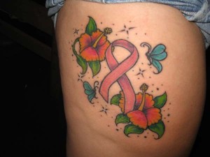 Colourful flowers with pink ribbon tattoo