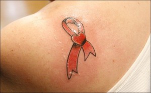 Pink ribbon and heart tattoo