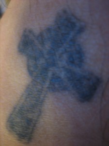 Celtic cross tattoo on man's back