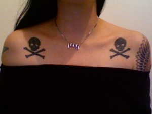 Skulls and Crossbones Collar Bone Tattoos