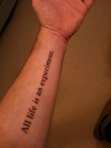 quote tattoo that says "all life is an experiment"