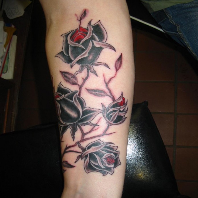 rose tattoo on forearm