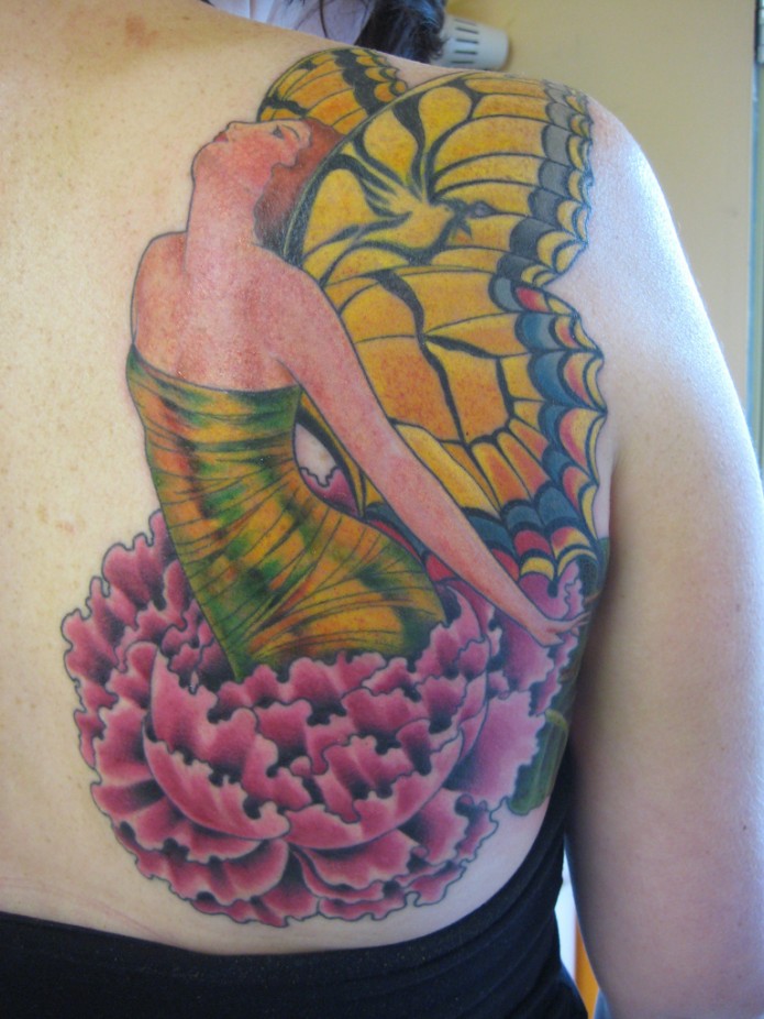 flower tattoo on shoulder blade