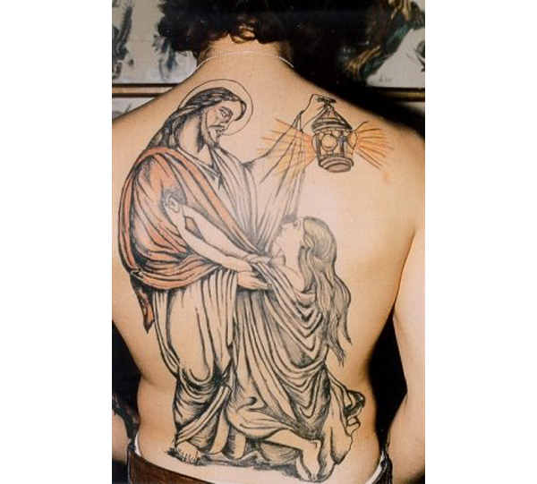 christian tattoo on back