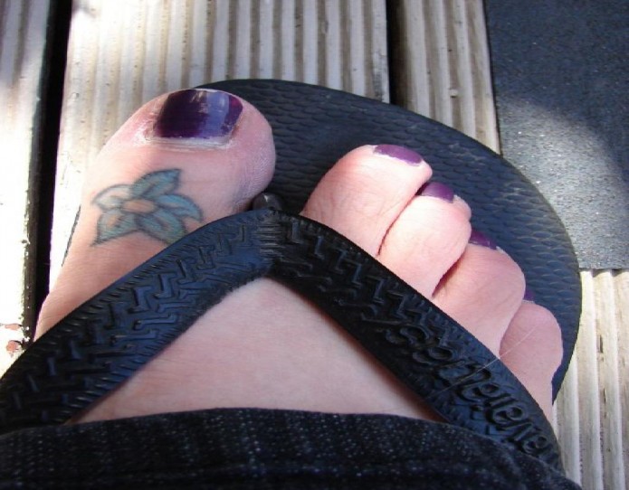 flower tattoo on toe