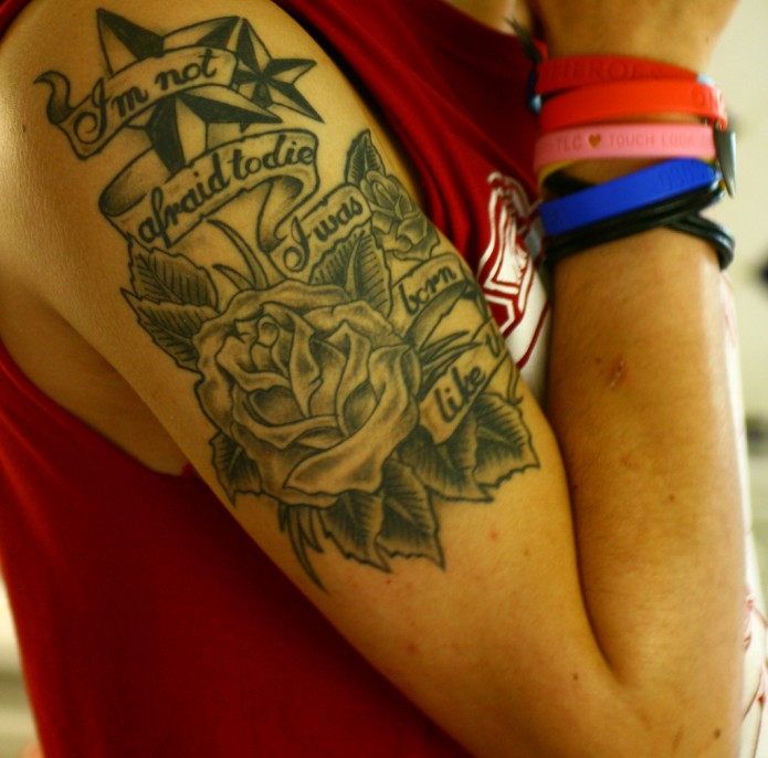rose tattoo on arm