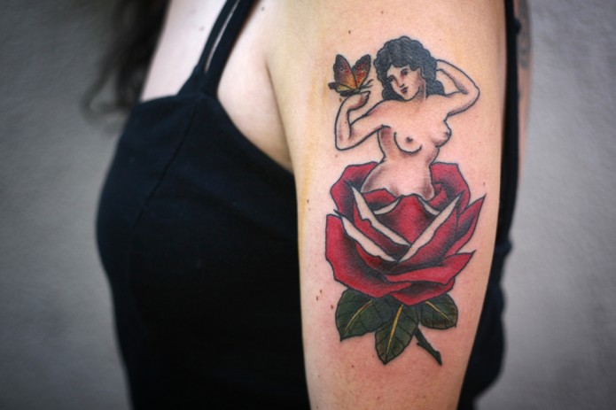 rose tattoo on arm