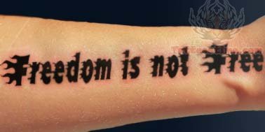 lettering tattoo on forearm