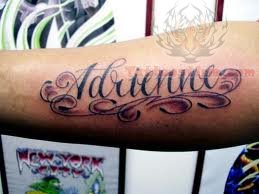 lettering tattoo on forearm