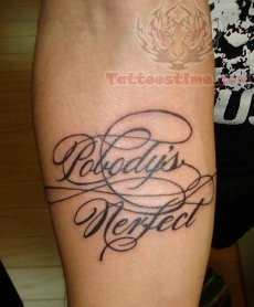 lettering tattoo on forearm