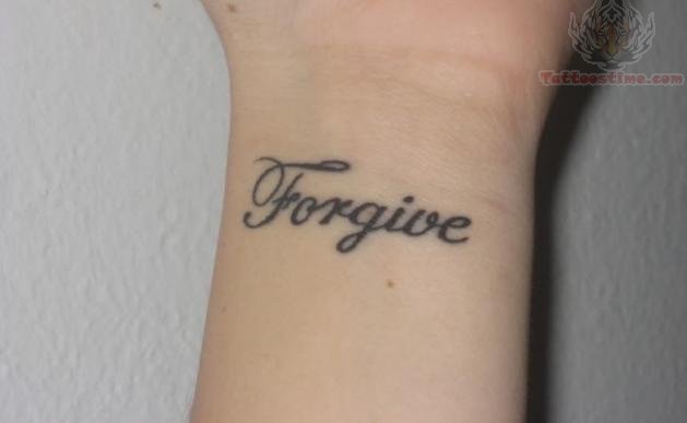 lettering tattoo on wrist