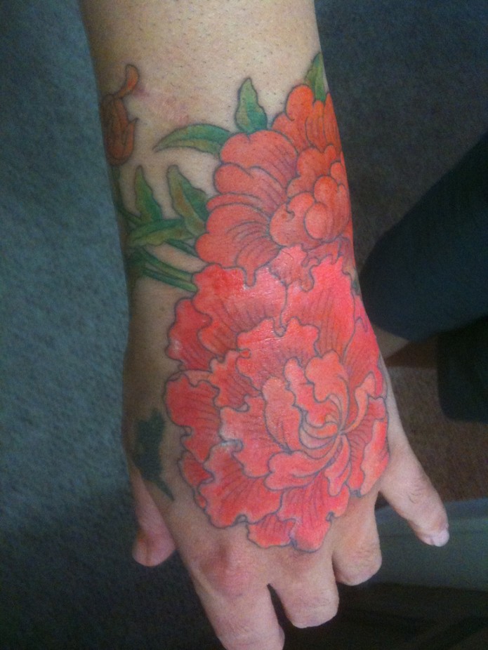 flower tattoo on hand