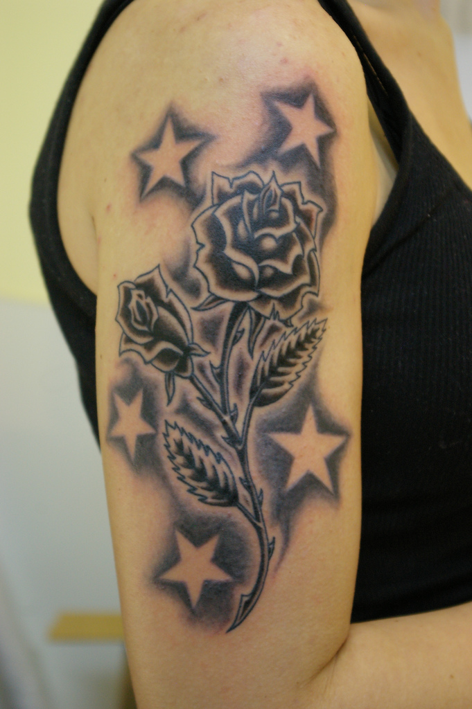 rose tattoo on forearm