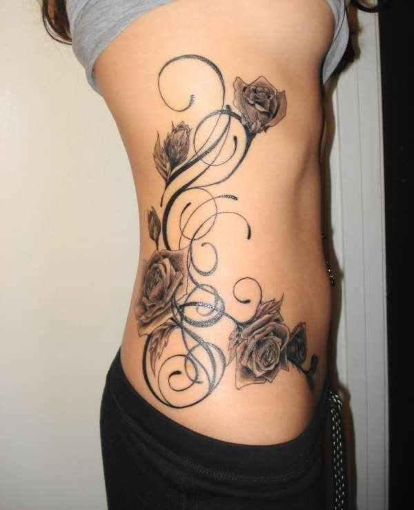 rose tattoo on rib cage & waist