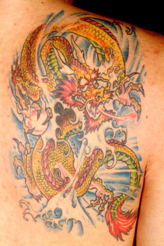dragon tattoo on shoulder blade