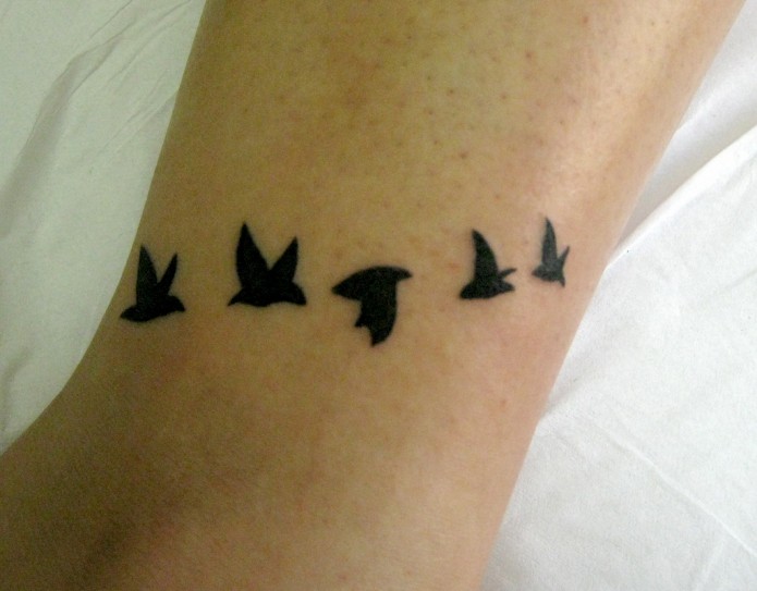 bird tattoo on leg