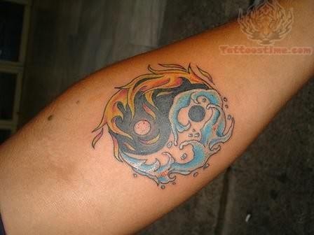 yin yang tattoo on forearm