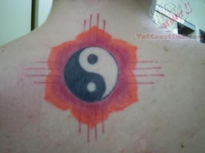 yin yang tattoo on back