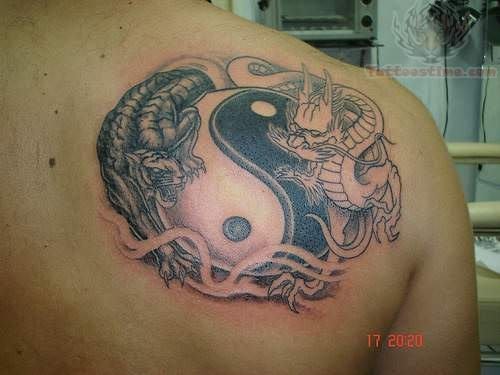 yin yang tattoo on back