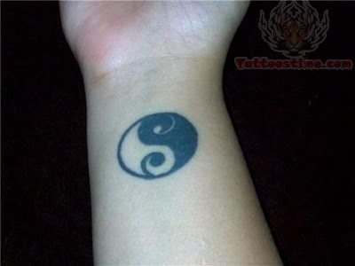 yin yang tattoo on wrist