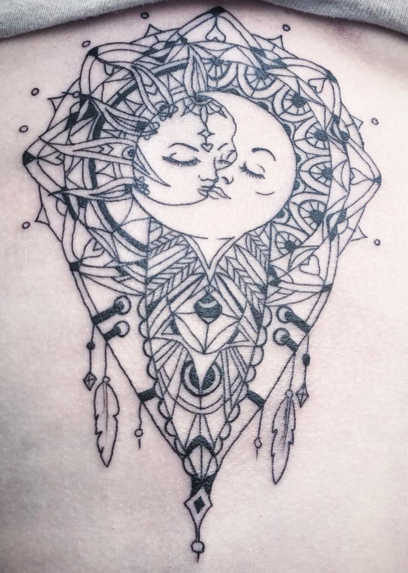The sun and moon kissing tattoo design is often referred to as "The Lo...