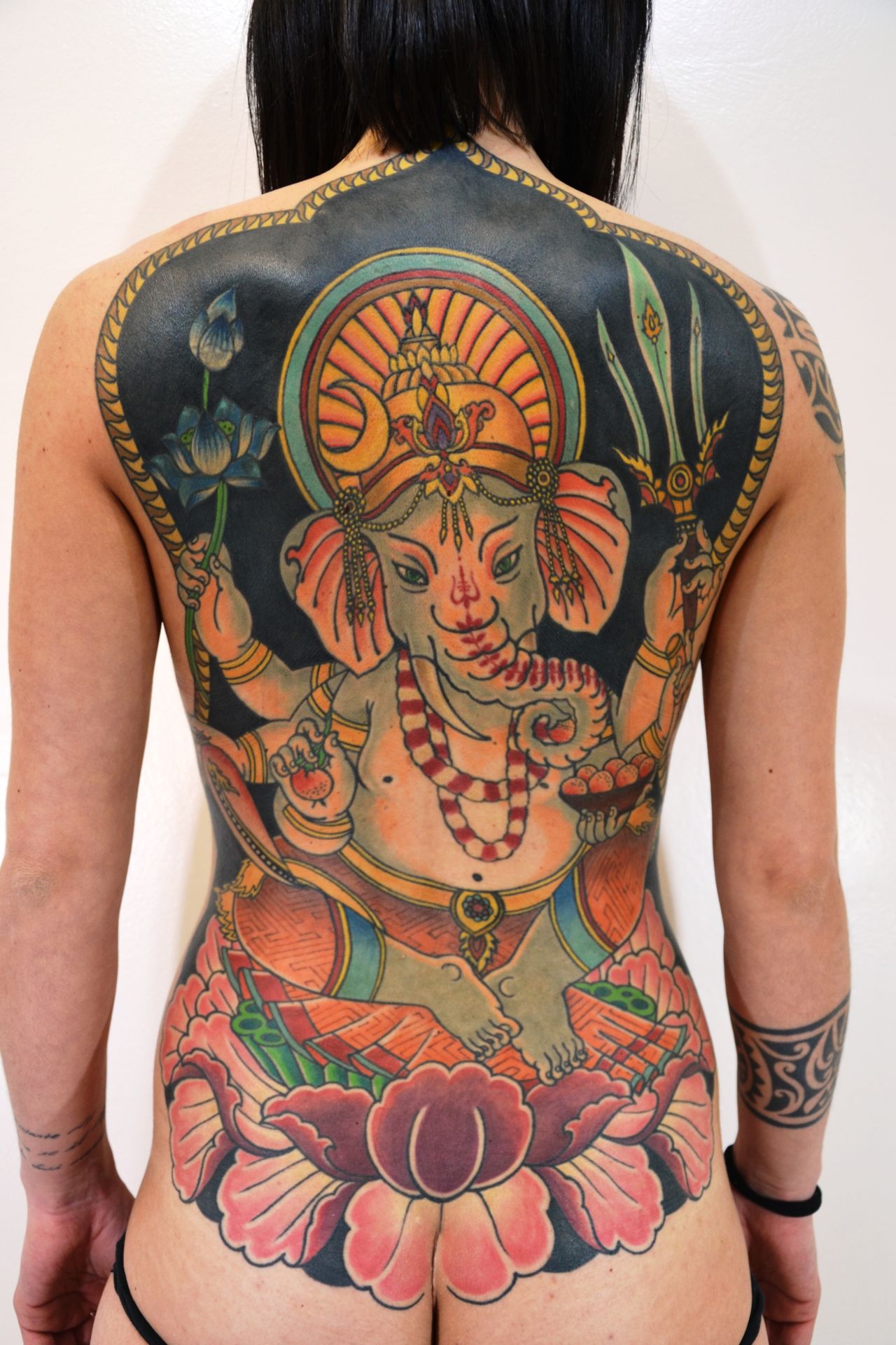 Why do people get Ganesha tattoo? - Ace Tattooz