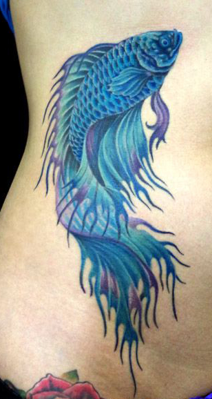 Betta fish tattoo on the inner forearm