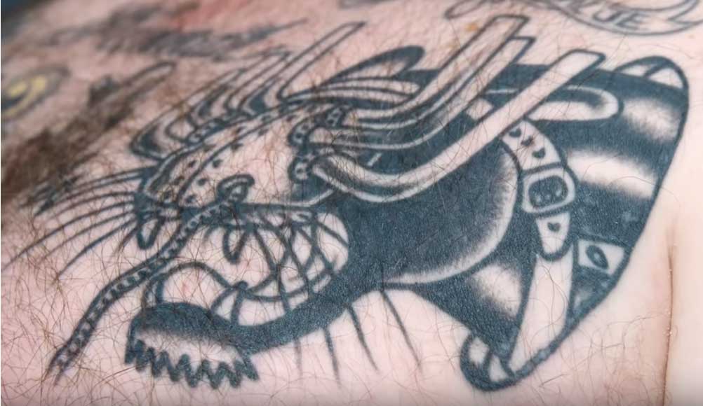 Action Bronson reveals his crazy tattoo collection and breaks them down