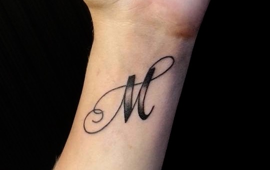 Letter M Tattoo Stock Photos and Images - 123RF