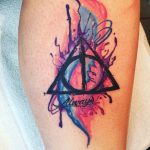 my newest tattoo deathly hallows with the hogwarts house colors in  watercolor deathlyhallows harrypottertattoo  Tattoos Harry potter  tattoos Hogwarts tattoo