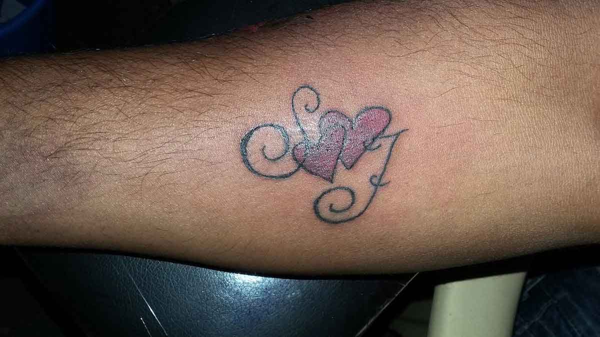 Tattoo of JJG heart Bond love tattoo  custom tattoo designs on  TattooTribescom