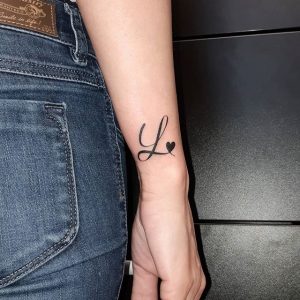Cursive Name Tattoos On Wrist With Hearts