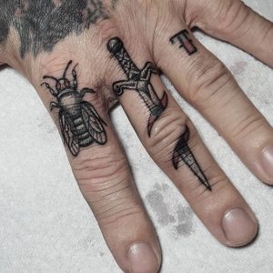 21 Attractive Sword Finger Tattoos