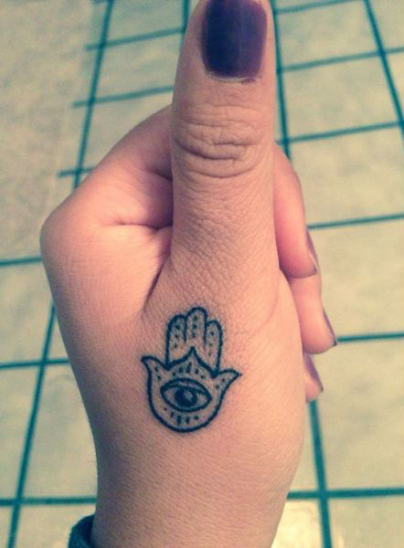 Hamsa with evil eye tattoo