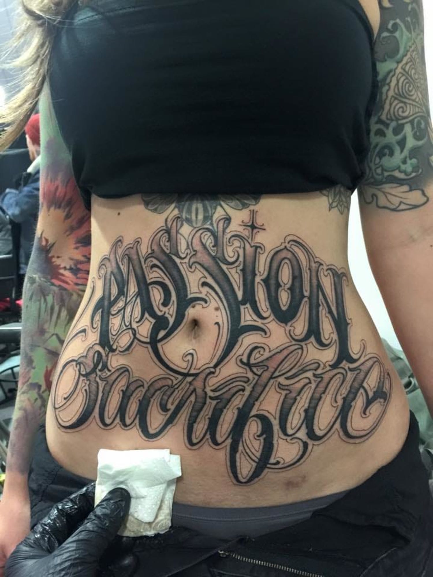 Lettering Tattoos on Stomach.
