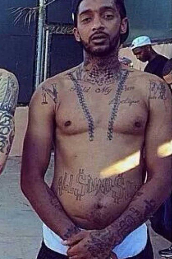 Nipsey had a tattoo of a chain broken in the middle on his chest hanging fr...