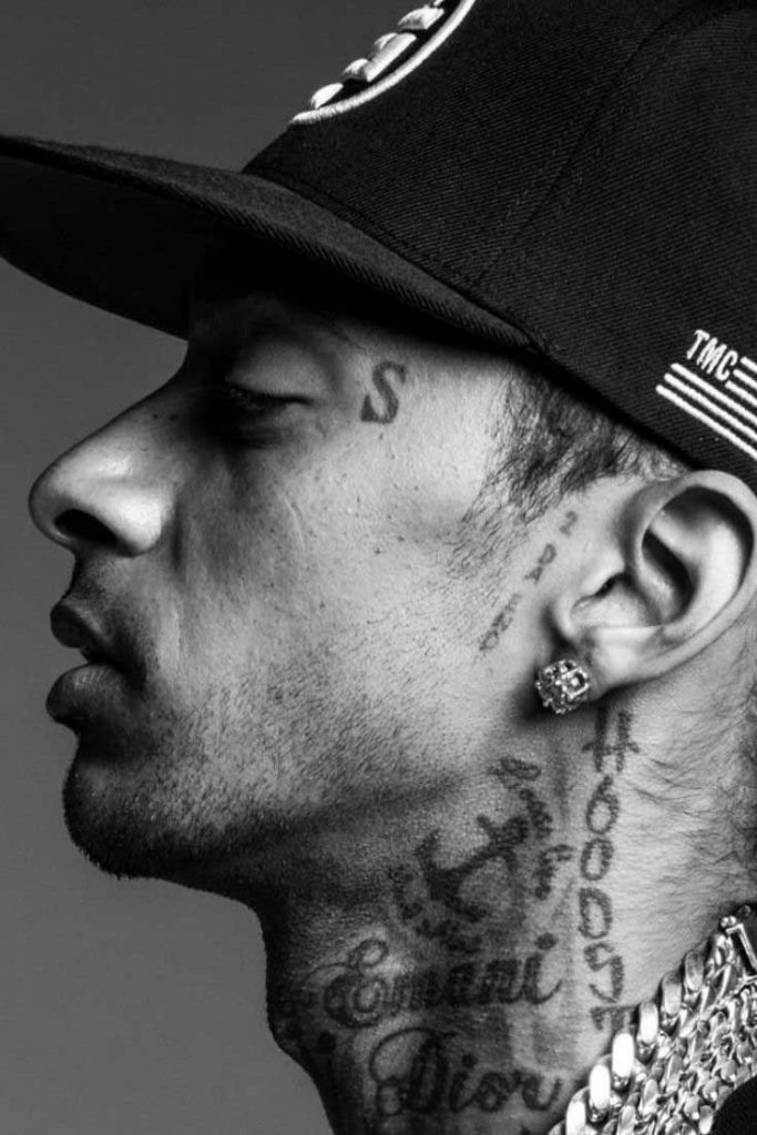 Behind his left sideburns Nipsey had the words "2 DA END" tattooe...