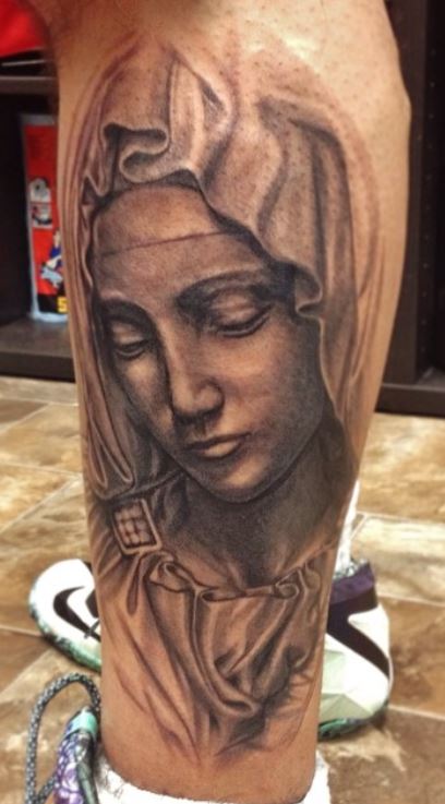 Matching hand poked Virgin Mary tattoo for couple