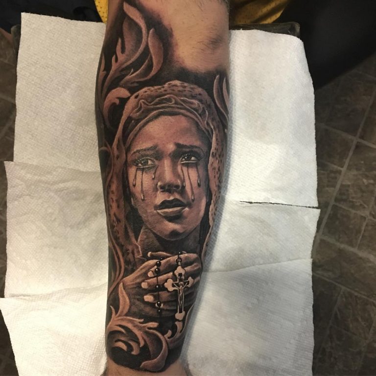 Virgin Mary tattoo done on the inner forearm healed
