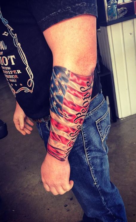 realistic flag tattoo done at Masterpiece Tattoo in San Francisco