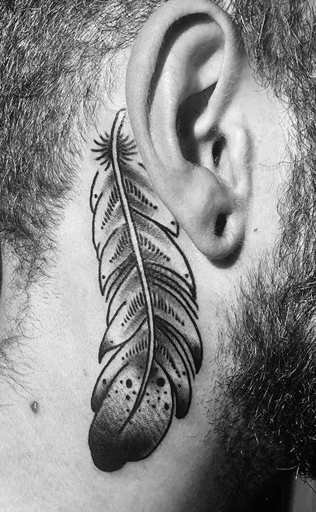 Cherry blossom cover up tattoo located behind the ear